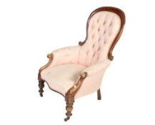 A Victorian mahogany framed button back armchair.