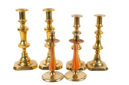Three pairs of 19th century and later brass candlesticks.