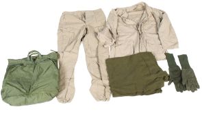 A group of military clothing in a 'Flyer's Helmet Bag'. Including shirt, trousers and gloves, etc.