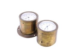 Two vintage car clocks.