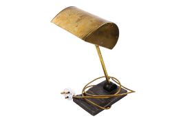 A vintage brass desk lamp.