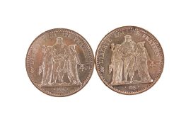 Two silver 10 franc coins, dated 1966 and 1970.