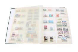 Three stock books containing over 2000 railway and assorted stamps.