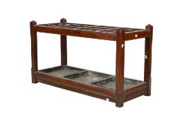 A large late 19th century oak Arts and Crafts stick stand.