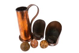 A vintage copper pitcher and two scuttle scoops.
