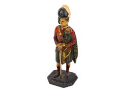 An enamelled metal table lighter in the form of a Scottish Highland regiment officer.