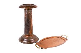 A copper jardiniere stand and a copper tray.