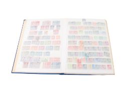 A well filled stock book of Danish stamps with inverted framed.