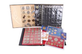 Two albums of 20th century world coins.