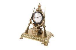 A Victorian brass desk clock.