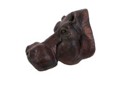 A vintage carved wooden hippo head.