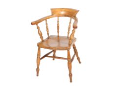 An elm wood smokers bow country chair.