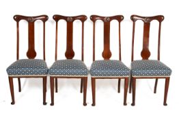 A set of four 20th century dining chairs.