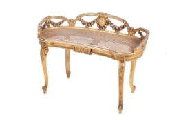 An early 20th century giltwood kidney-shaped stool or window seat.