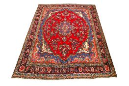 A vintage Persian woollen rug.