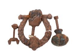A cast metal doorknob and a door knocker.