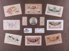 A framed collection of WWI period embroidered and other postcards.
