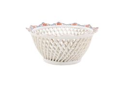 A 20th century European porcelain lattice bowl in the Japanese Kakiemon style.