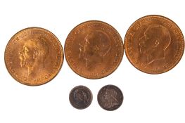 Five 19th and 20th century coins.
