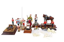 A group of hand painted lead and resin military figures.