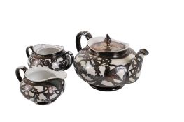 A late 19th century three-piece porcelain tea service.
