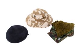 Three vintage military hats.