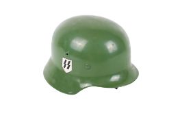 A reproduction WWII German soldier's helmet. In green, with side emblems, and leather inner fitting.