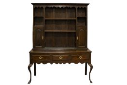An Arts and Crafts stained oak dresser, in the Liberty style.