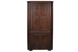 A Victorian stained pine freestanding corner cupboard.