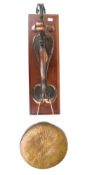 An Art Nouveau wall mount with a brass gong.