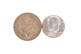 A USA 1880 dollar and a 1964 half dollar coin