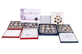A collection of Royal Mint coin sets. Including 1996, 1999, 2001 and 2003; 1986 B.U.