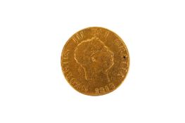 An 1818 half sovereign coin. Milling removed, ex jewellery piece, weight 3.9g.