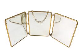 A vintage brass framed triptych folding travel mirror.