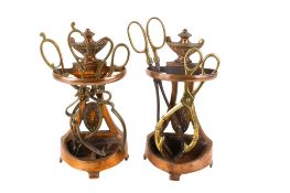 A pair of Georgian copper poker stands four pairs of brass tongs.