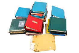 A large collection of assorted stamp albums, in a suitcase.