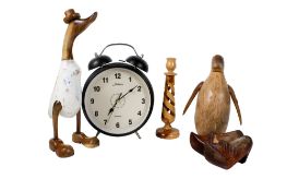 A group of assorted wooden ornaments and a large 'alarm' clock.