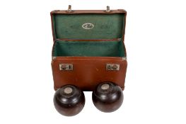 Pair of vintage crown lawn bowls with white metal mounts, cased.
