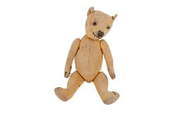 A mid-century English jointed teddy bear.