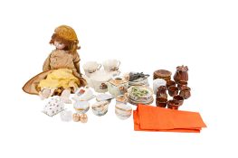A late 19th/early 20th century doll and three doll's tea services.