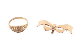 A 9ct gold brooch and 18ct gold and diamond ring. The brooch modelled as a bow, weight 2.