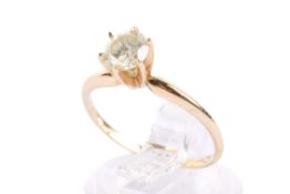 A yellow metal and diamond solitaire ring. Set with one round brilliant cut diamond of 0.