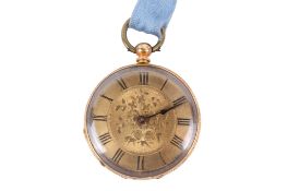 A yellow metal pocket watch.