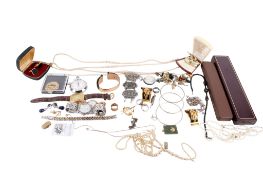 A collection of costume jewellery and wristwatches.