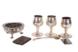 A small group of assorted silver pieces.