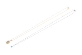 Two yellow and white metal pendants and chains.