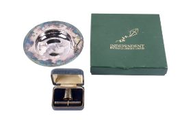 A boxed silver circular dish and boxed silver needlecase and thimble set.