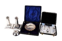 A small group of silver items.