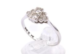 An 18ct gold and diamond dress ring. Set with round brilliant and single cut diamonds of 0.