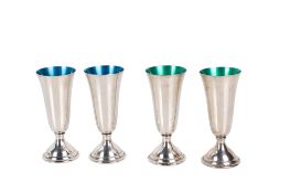 Four mid-20th century Swedish silver and enamel spirit cups.